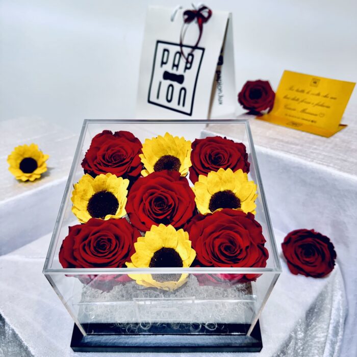 luxury flowerbox in plexiglass con cinque rose rosse stabilizzate e quattro girasoli stabilizzati